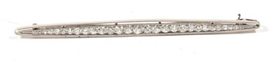Lot 226 - An Art Deco diamond bar brooch, of tapering from, set with graduated old cut diamonds, total...