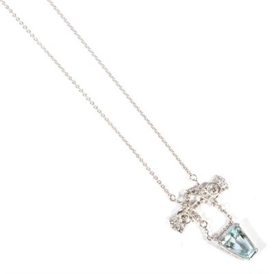 Lot 230 - An Art Deco aquamarine and diamond pendant, on chain, a grain set old cut diamond scroll suspends a