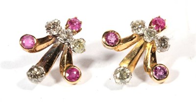 Lot 238 - A pair of 1940s ruby and diamond earrings, inverted fleur de lis motifs set with round cut...