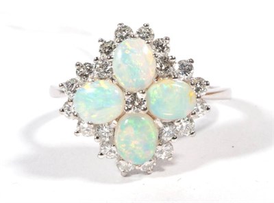 Lot 241 - An opal and diamond cluster ring, four oval cut opals with a central round brilliant cut...