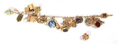 Lot 246 - A 9 carat gold charm bracelet, 57.6g gross