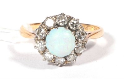 Lot 262 - An opal and diamond cluster ring, total estimated diamond weight 0.50 carat approximately,...
