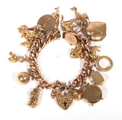 Lot 264 - A 9 carat gold charm bracelet and four loose charms and a cross pendant, 57.8g gross