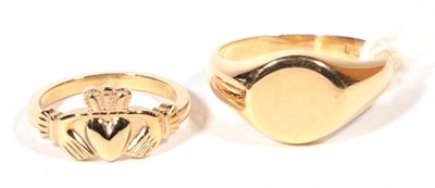 Lot 284 - An 18ct gold signet ring, finger size U1/2, 12.0g and a 9ct gold claddagh ring, finger size M, 3.8g