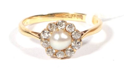 Lot 286 - ~ An early 20th century pearl and diamond cluster ring, a central pearl within a border of old...