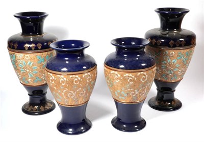 Lot 315 - ~ A pair of Royal Doulton stoneware blue and gilt decorated tapering vases, 33cm high; together...