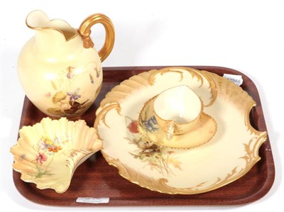 Lot 346 - A Royal Worcester blush ivory jug; a shell dish; a shell shaped plate; a cup and saucer