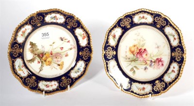 Lot 355 - A pair of Royal Worcester blue ground floral decorated cabinet plates, 23cm diameter