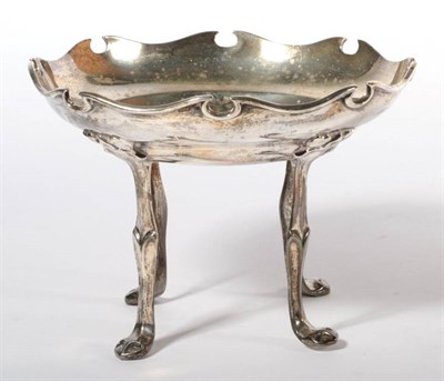 Lot 360 - ~ An Edwardian Art Nouveau silver dish, by William Hutton & Sons, London, 1906, raised on four tall