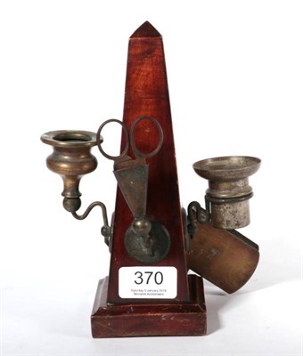 Lot 370 - A Victorian obelisk form all-in-one candlestick, snuffer, wick cutter and match holder