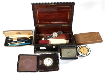 Lot 394 - Late 19th century rosewood jewellery box; a quantity of fountain pens; travel clocks