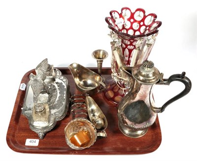 Lot 404 - A Victorian silver cream jug, London 1888; a silver toast rack Sheffield 1933; two silver sauce...