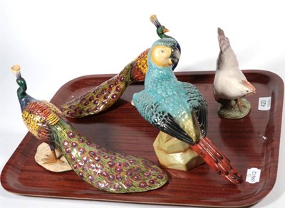 Lot 420 - A pair of china figures modelled as peacocks; a Royal Copenhagen figure of a hen; and a Continental