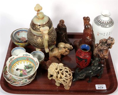 Lot 424 - A tray of Oriental items to include tea bowls; a koro; libation cup; hardwood figures etc