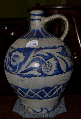 Lot 439 - A Continental pottery flagon decorated with flowers