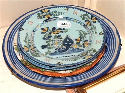 Lot 444 - A 19th century Delft charger; an Italian tin glazed pottery plate depicting two figures and a...