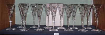 Lot 463 - A set of thirteen Jasper Conran Stuart Crystal Aura pattern champagne flutes