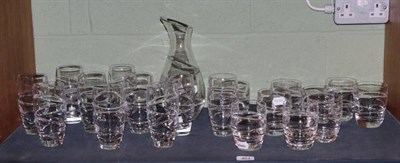 Lot 464 - A set of ten Jasper Conran Stuart Crystal Aura pattern high balls; nine tumblers and a carafe