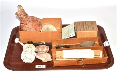 Lot 473 - A small group of antiquities including an 18th century bronze trefid spoon; Roman oil lamps;...