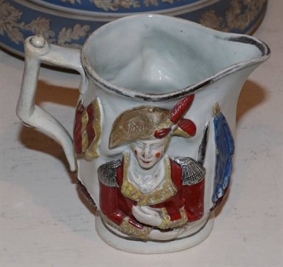 Lot 476 - ~ A 19th century relief decorated jug, one side decorated and stamped Lord Wellington, the opposing