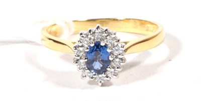 Lot 486 - An 18ct gold diamond and sapphire cluster ring, total estimated diamond weight 0.25 carat...