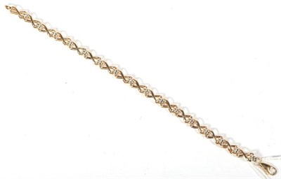 Lot 487 - A 9 carat two colour gold x-link bracelet, length 18cm