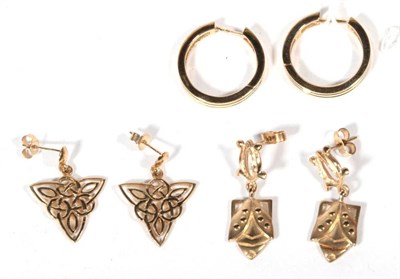 Lot 492 - Three pairs of 9 carat gold earrings, comprising Celtic motif drop earrings, hoop earrings and...