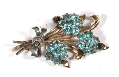 Lot 500 - A blue zircon spray brooch, measures 4.5cm by 3.5cm, stamped '9CT & PLAT', 11.5g