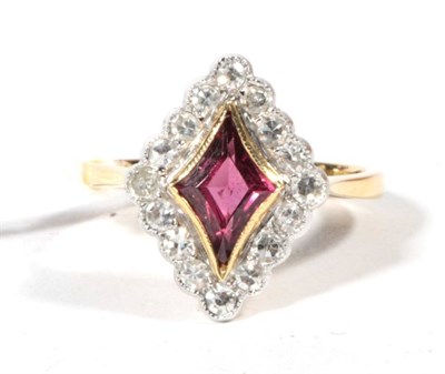 Lot 503 - A ruby and single-cut diamond cluster ring, finger size L1/2, stamped '18CT' and 'PLAT', 4.3g