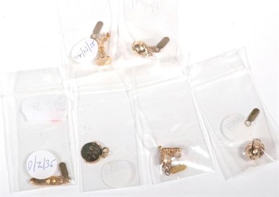 Lot 509 - Six various 9 carat gold charms, including; an Easter egg, a spinning charm, a church, a...