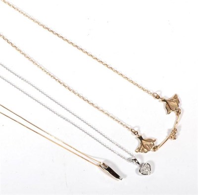 Lot 517 - A 9 carat gold leaf link necklace, a diamond pendant on chain and a diamond heart shaped pendant on