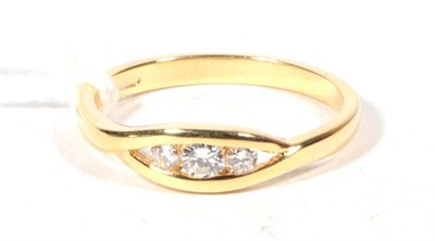 Lot 518 - An 18ct gold diamond three stone ring, finger size O, 3.1g