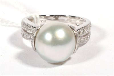 Lot 526 - A cultured pearl and diamond ring, a cultured pearl within a cup setting, grain set with round...