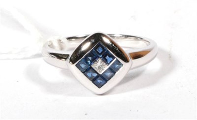 Lot 529 - An 18ct white gold diamond and sapphire cluster ring, finger size M1/2, 4.2g