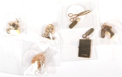 Lot 534 - Six various 9 carat gold charms, including; a barrel, a teapot, a clog, a hedgehog, a pair of...