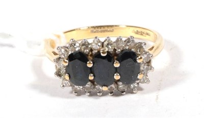 Lot 541 - An 18 carat gold sapphire and diamond cluster ring, finger size  P1/2, 4.7g