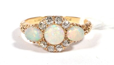 Lot 544 - ~ A Victorian opal and diamond cluster Ring, a round opal within a border of old cut diamonds,...