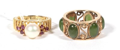 Lot 545 - A 1970s cultured pearl and ruby ring, finger size L, stamped '750 18K', 3.6g and a nephrite...