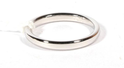 Lot 548 - A platinum band ring, finger size J