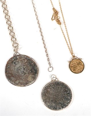 Lot 555 - A George V 1912 half sovereign, loose mount as a pendant on chain, 8.7g gross and two coin pendants