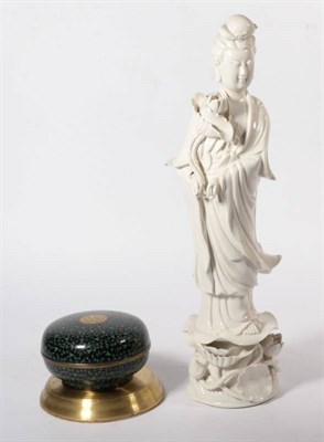 Lot 569 - A Chinese Blanc de Chine model of Guanyin; and a Cloisonne enamel box and cover (2)