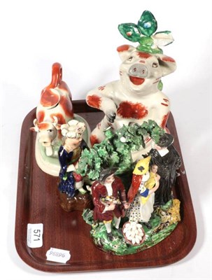 Lot 571 - A 19th century Staffordshire bocage figure group (a.f.); a further Staffordshire figure; a cow...