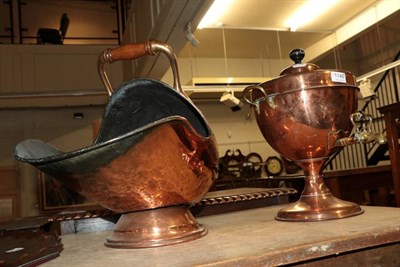 Lot 1146 - A copper coal helmet; an oyster veneered twin-handled tray and a copper samovar (3)