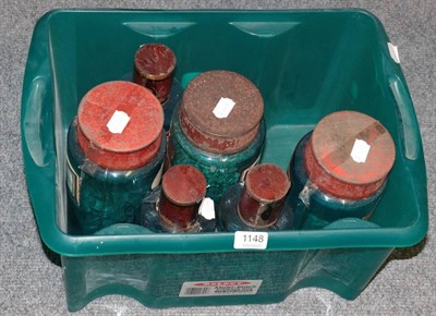 Lot 1148 - Six blue glass apothecary jars with porcelain labels, tin covers (6)