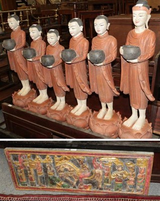 Lot 1154 - A graduated set of six painted and carved wooden figures of monks, 72cm to 89cm height,...