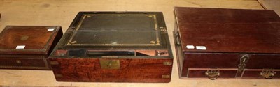 Lot 1163 - ~ A Victorian figured walnut and brass bound writing box with hinged lid enclosing a black...