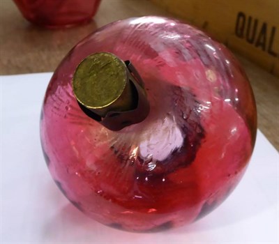 Lot 1165 - A pink satin glass oil lamp and shade; together with other lamps and plates