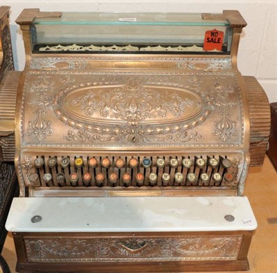 Lot 1206 - ~ A late Victorian brass national cash register, bearing plaque made by National Cash Register...