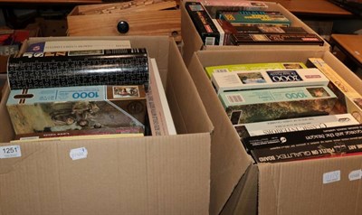 Lot 1251 - four boxes of jigsaw puzzles, etc