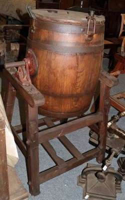 Lot 1265 - ~ An early 20th century staved oak and metal bound butter churn, labelled Waide & Sons, Churn...